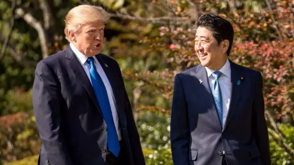 US President Donald Trump Attacked For 'Overfeeding' Koi Carp Of Japanese Prime Minister Shinzo Abe
