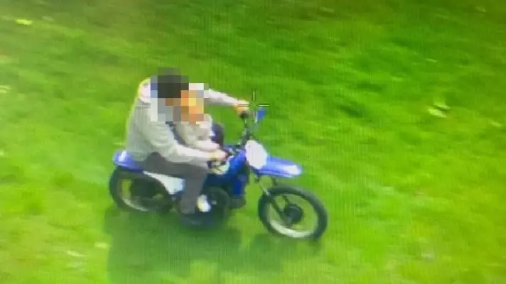 Dad Seen Riding Off-Road Bike With Infant Son Perched On His Lap 