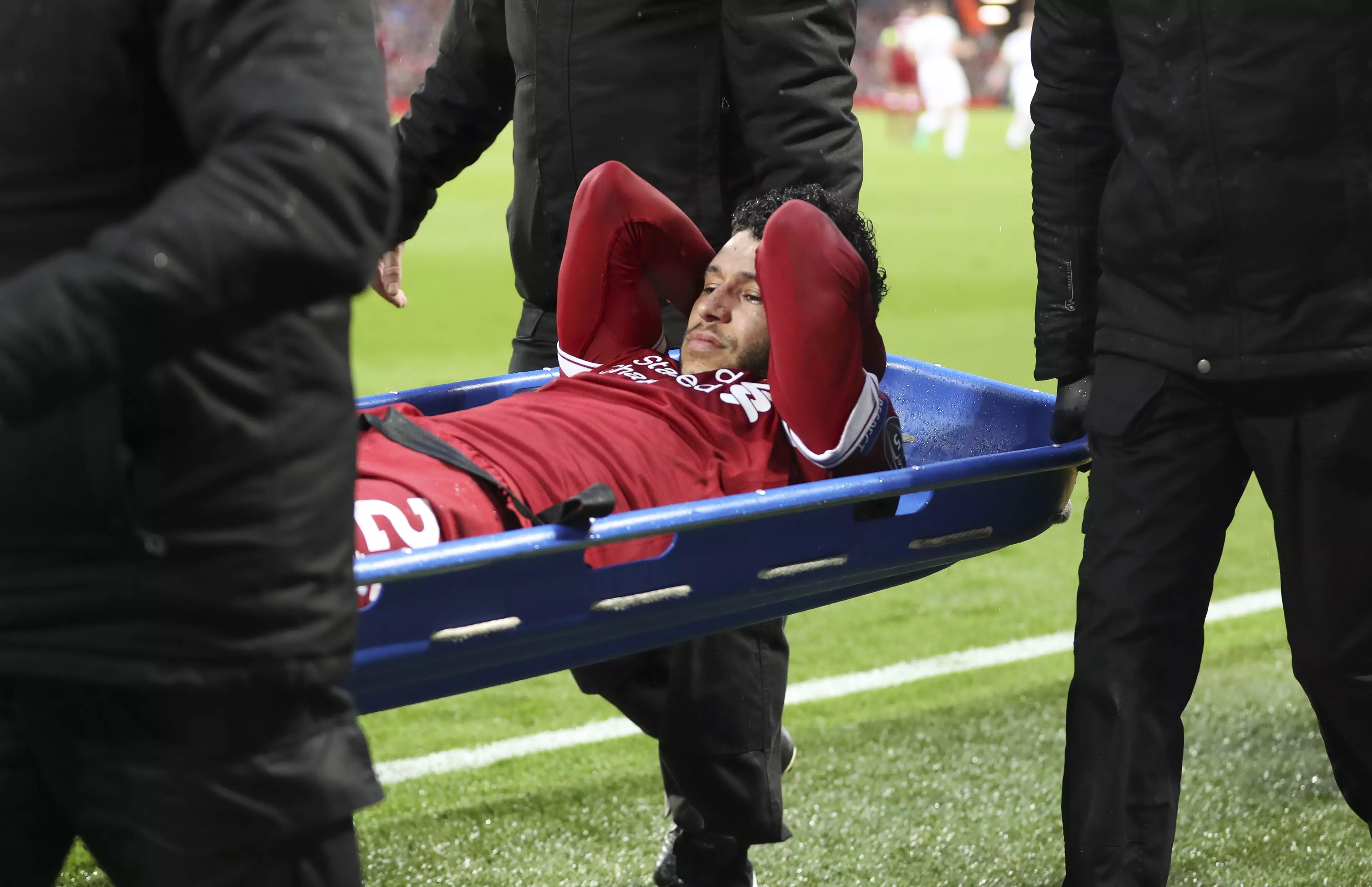 Oxlade-Chamberlain carried off on a stretcher. Image: PA