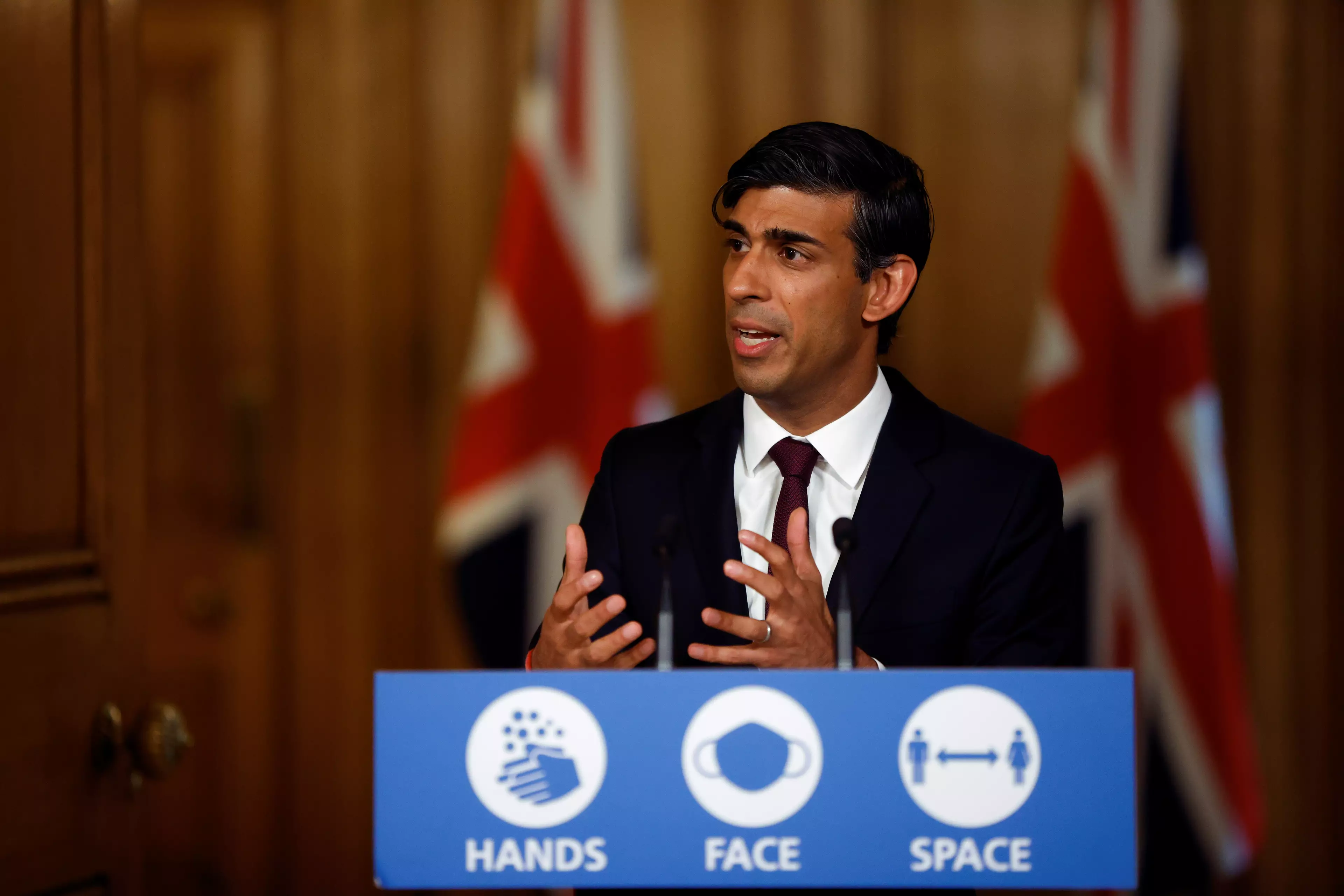Rishi Sunak says the government will pay two thirds of each employee's salary, up to a maximum of £2,100 per month, for those places forced to shut (