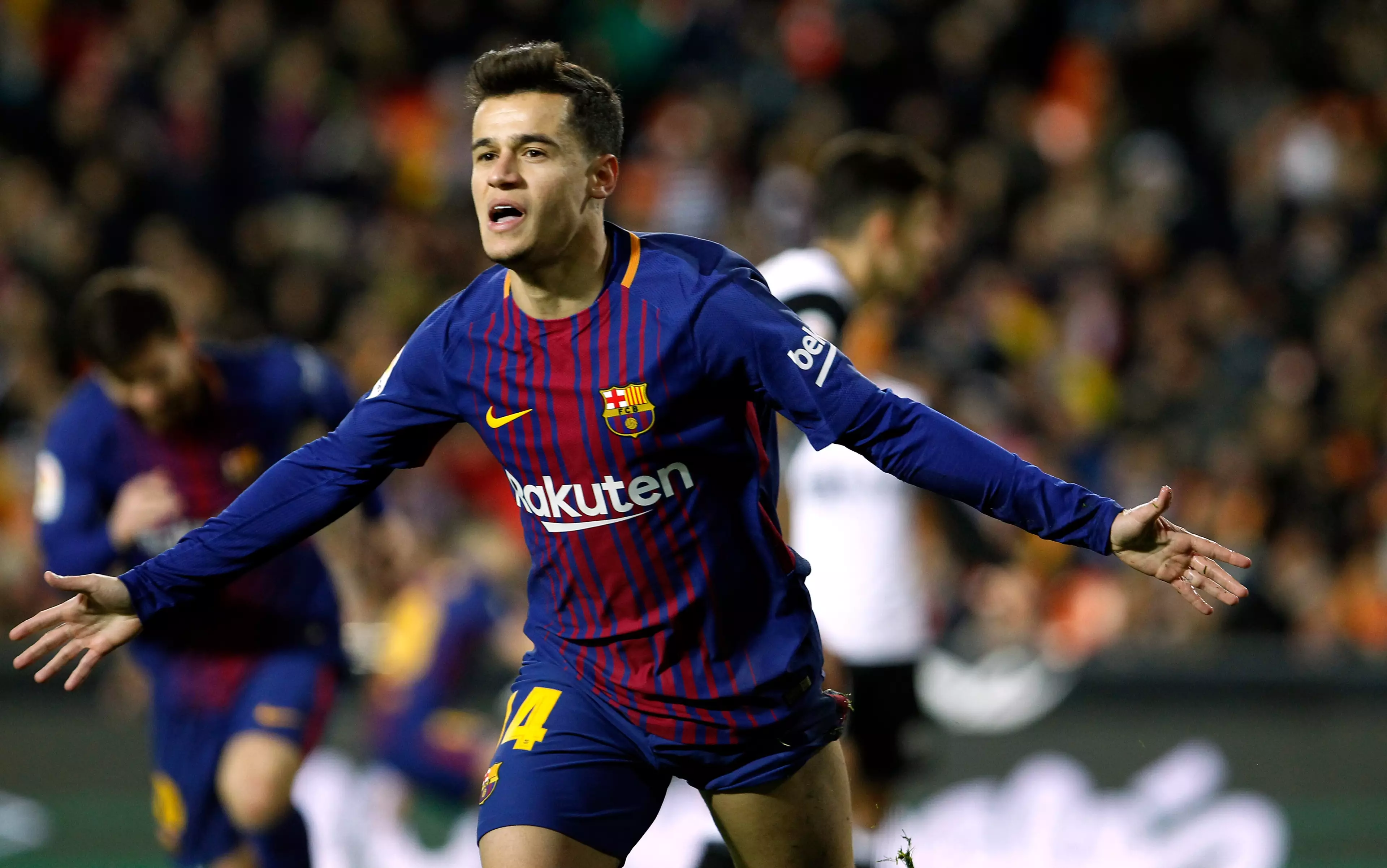 Coutinho wheels away in celebration after opening his Barcelona account. Image: PA