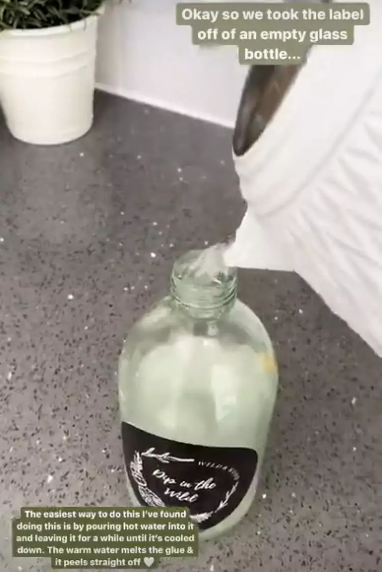 Stacey started by peeling a label off a glass bottle using boiling water (