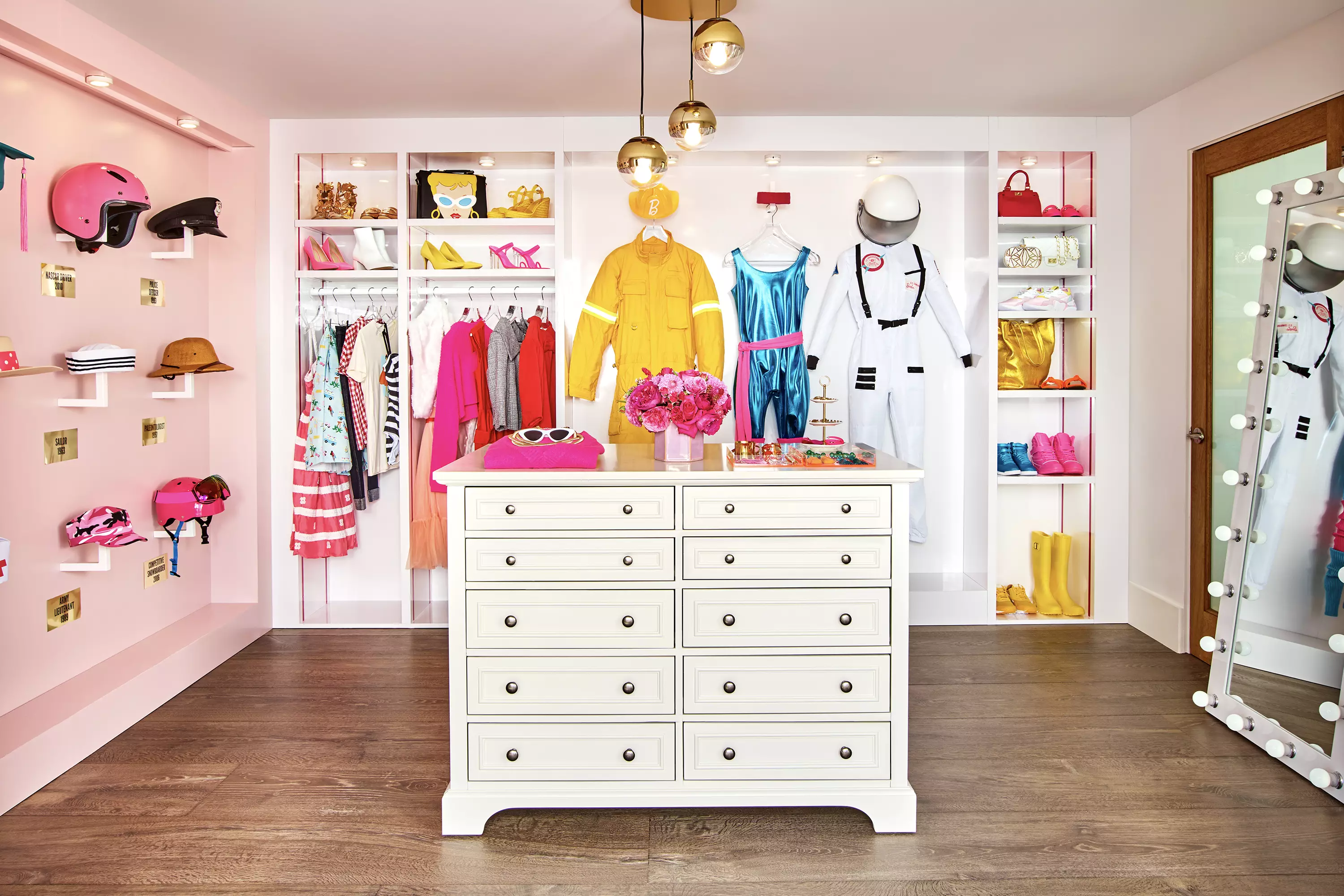 Barbie's dressing room features life-size versions of all her best outfits from over the years for a dress-up session. (