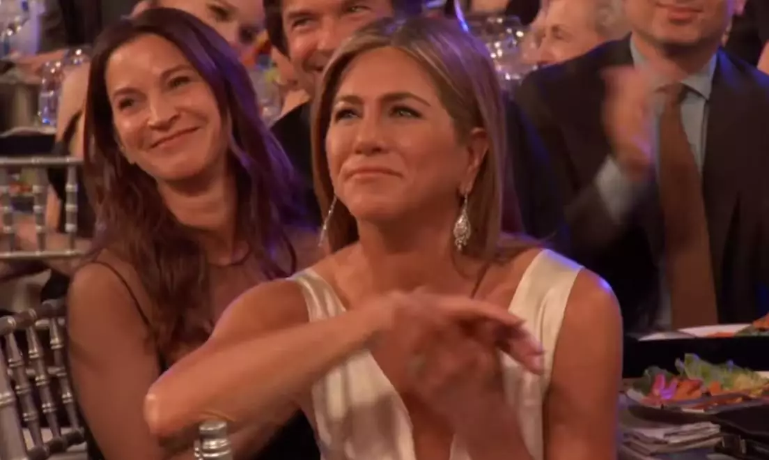 Jennifer Aniston clapped at Brad's joke.