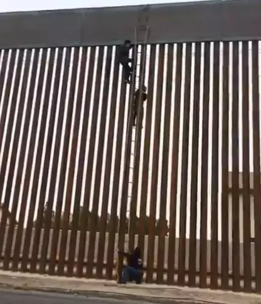 Police confirmed the person scaling the wall was a 16-year-old Mexican males.