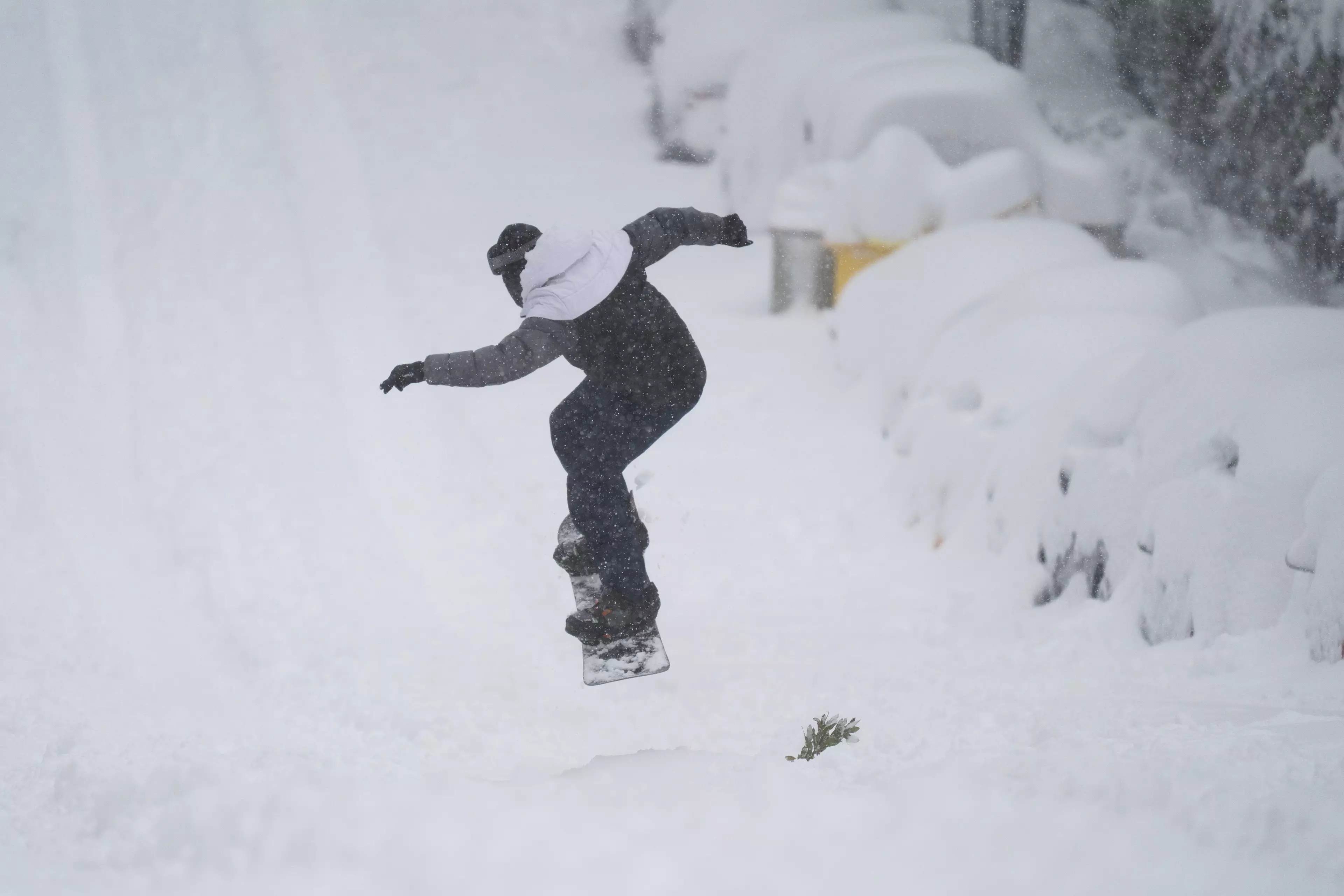 A man riding a snowboard in Madrid on Saturday (9 January).