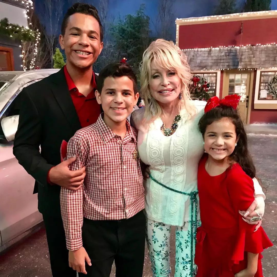 Talia Hill (far right) with Dolly Parton and her siblings and co-stars Tristan and Tyson Hill.