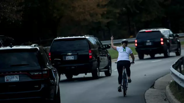 Woman Fired After Being Pictured Flipping Off President Donald Trump’s Motorcade 