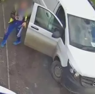 The driver could be seen at the back of his van (