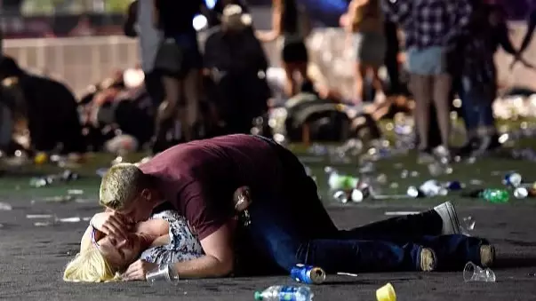 Photographer Says Couple Pictured On The Ground During Las Vegas Shooting Survived