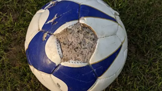 Man Finds Football Filled With Concrete In Playing Field Along With Cruel Note