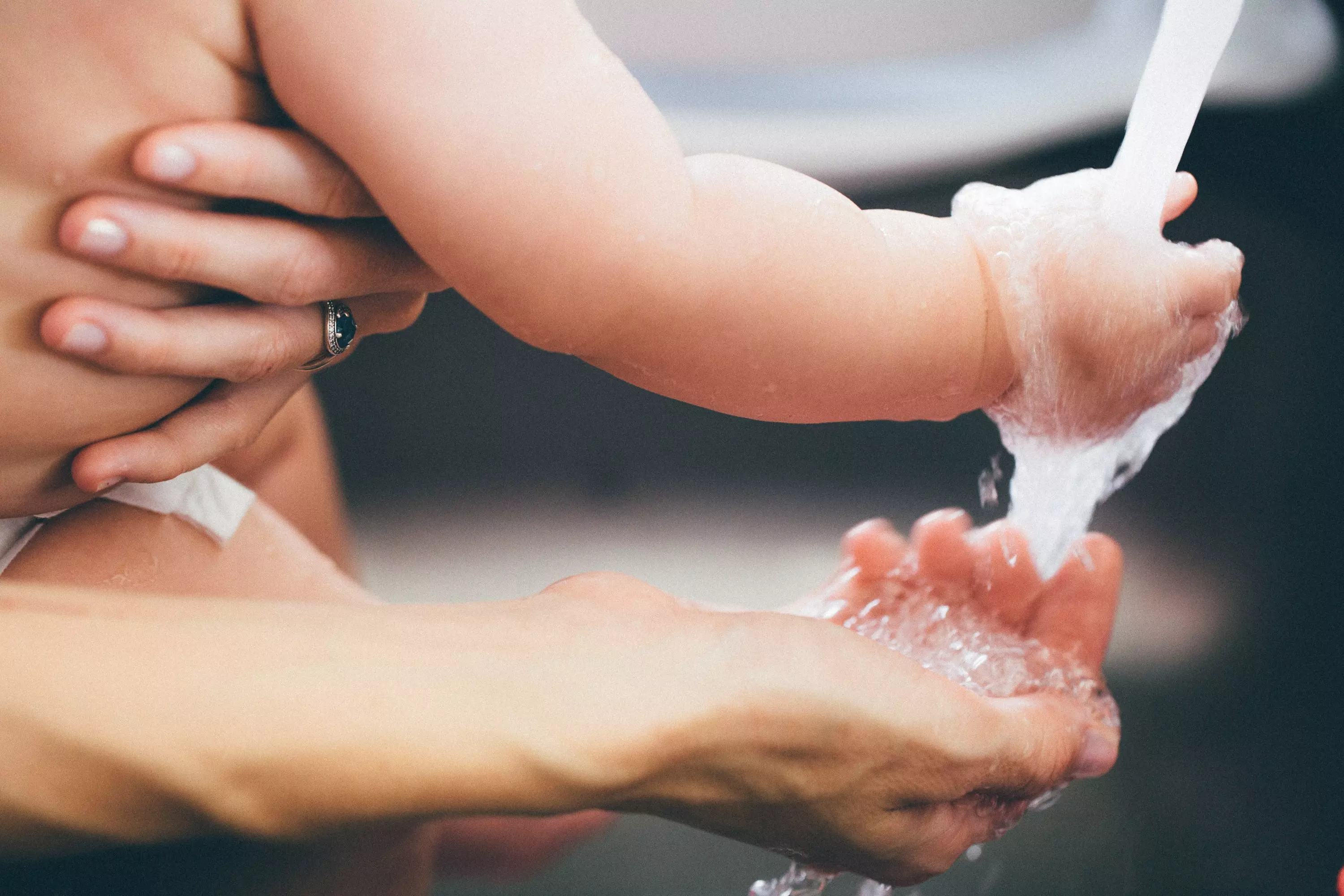 Washing a baby's hands is simple, but toddlers and primary school kids will need encouraging (