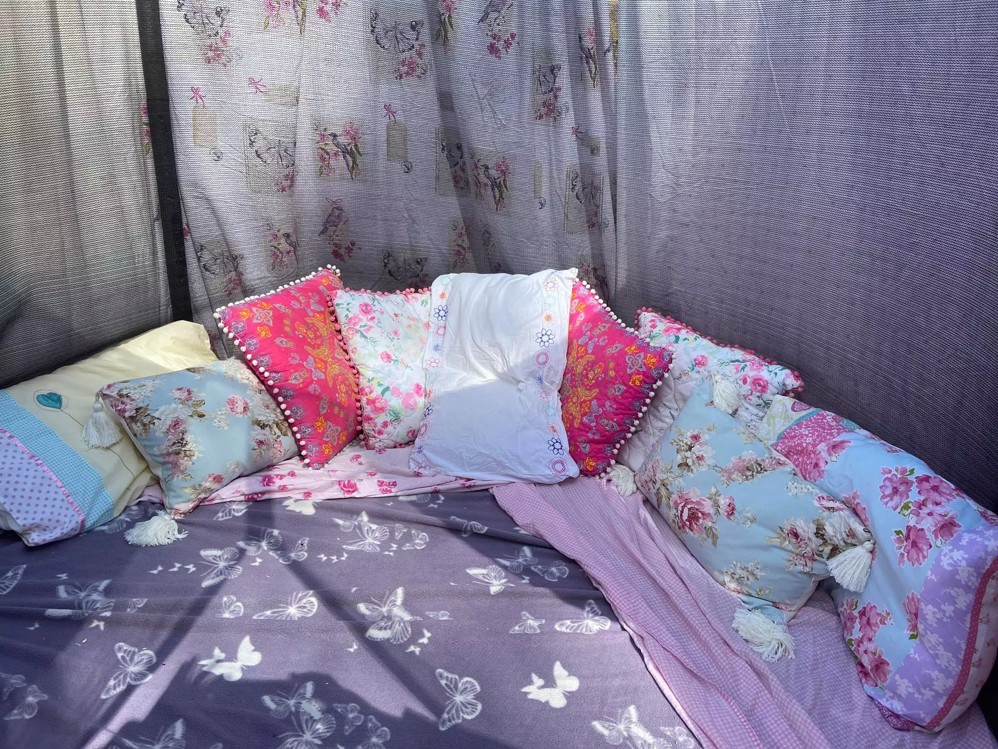 The mum-of-three decorated the inside with old sheets and cushions (