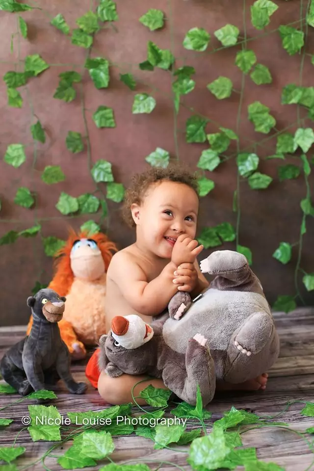 One baby adorably dressed up in a 'Jungle Book' scene (