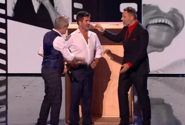 Cowell begrudgingly returned to the stage.