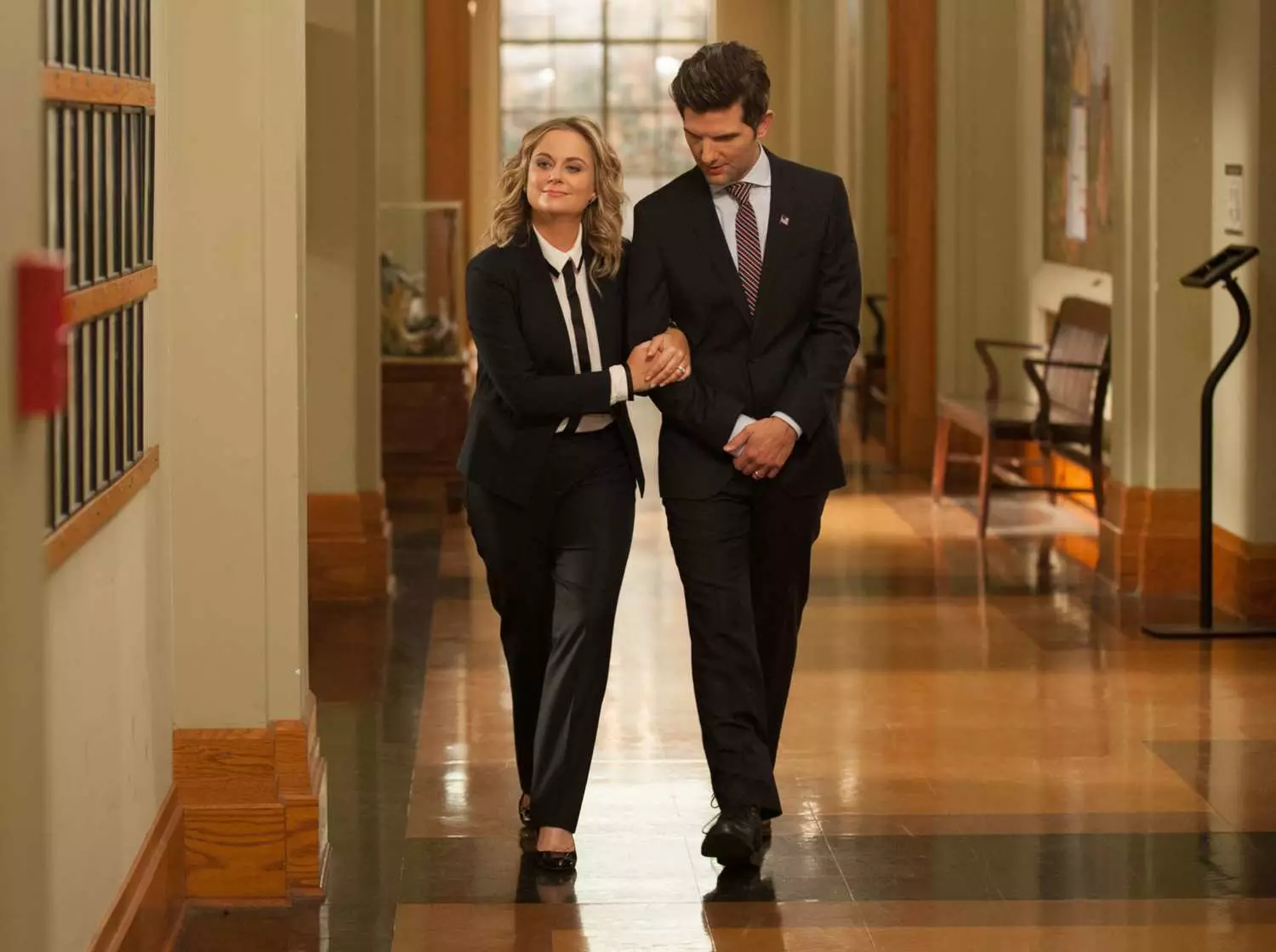 Amy Poehler as Leslie Knope and Adam Scott as Ben Wyatt in Parks and Recreation.