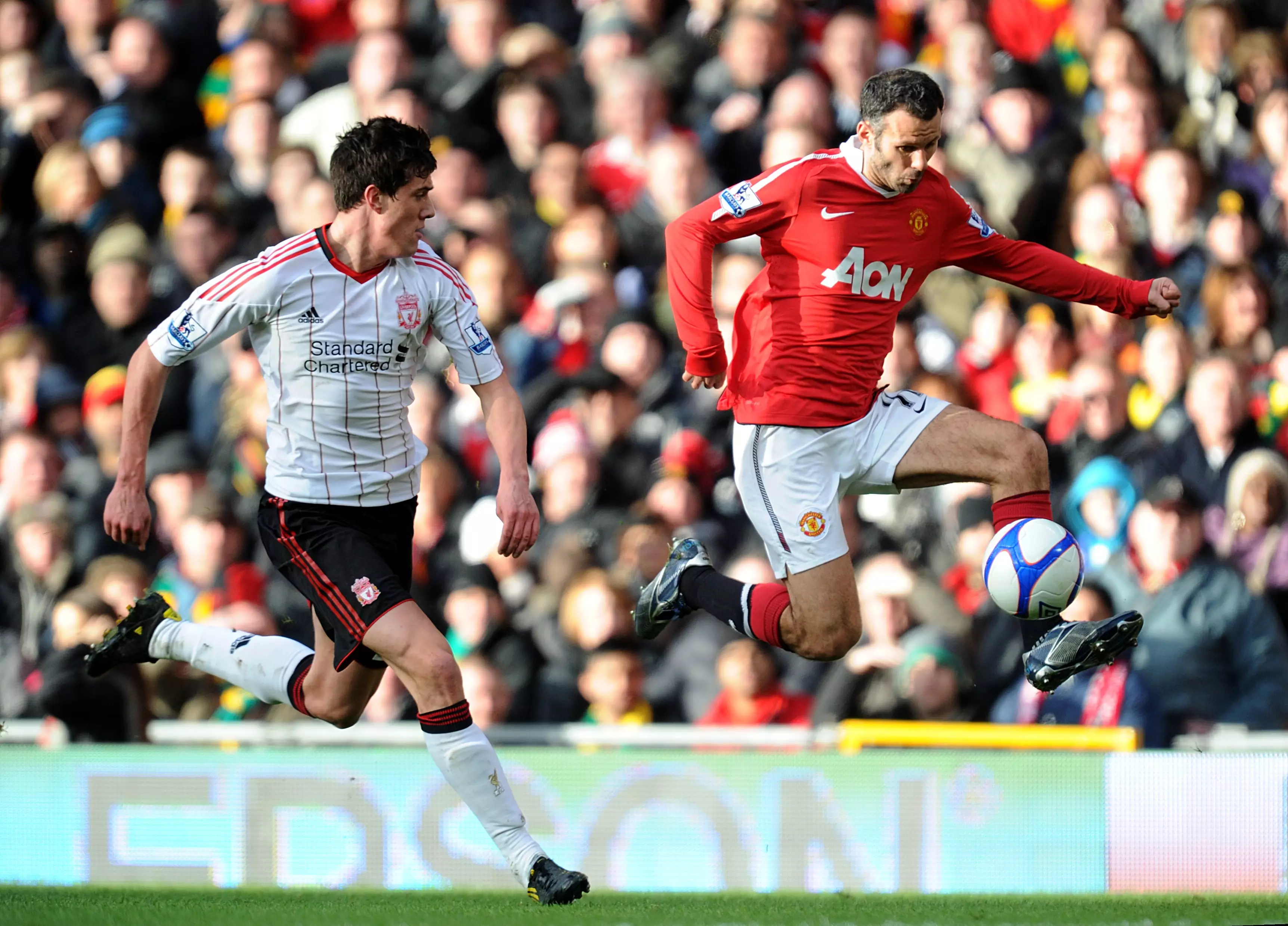 Giggs up against Martin Kelly on a different occasion. Image: PA Images