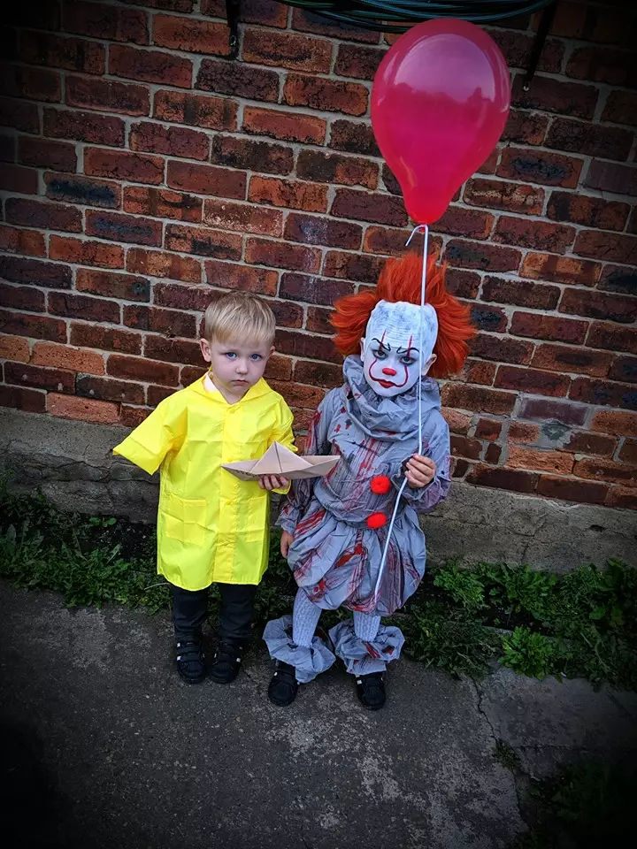 Miss Harrison's other son dressed as Georgie, who had his arm ripped off by Pennywise before being killed by the demonic clown in the first IT movie.