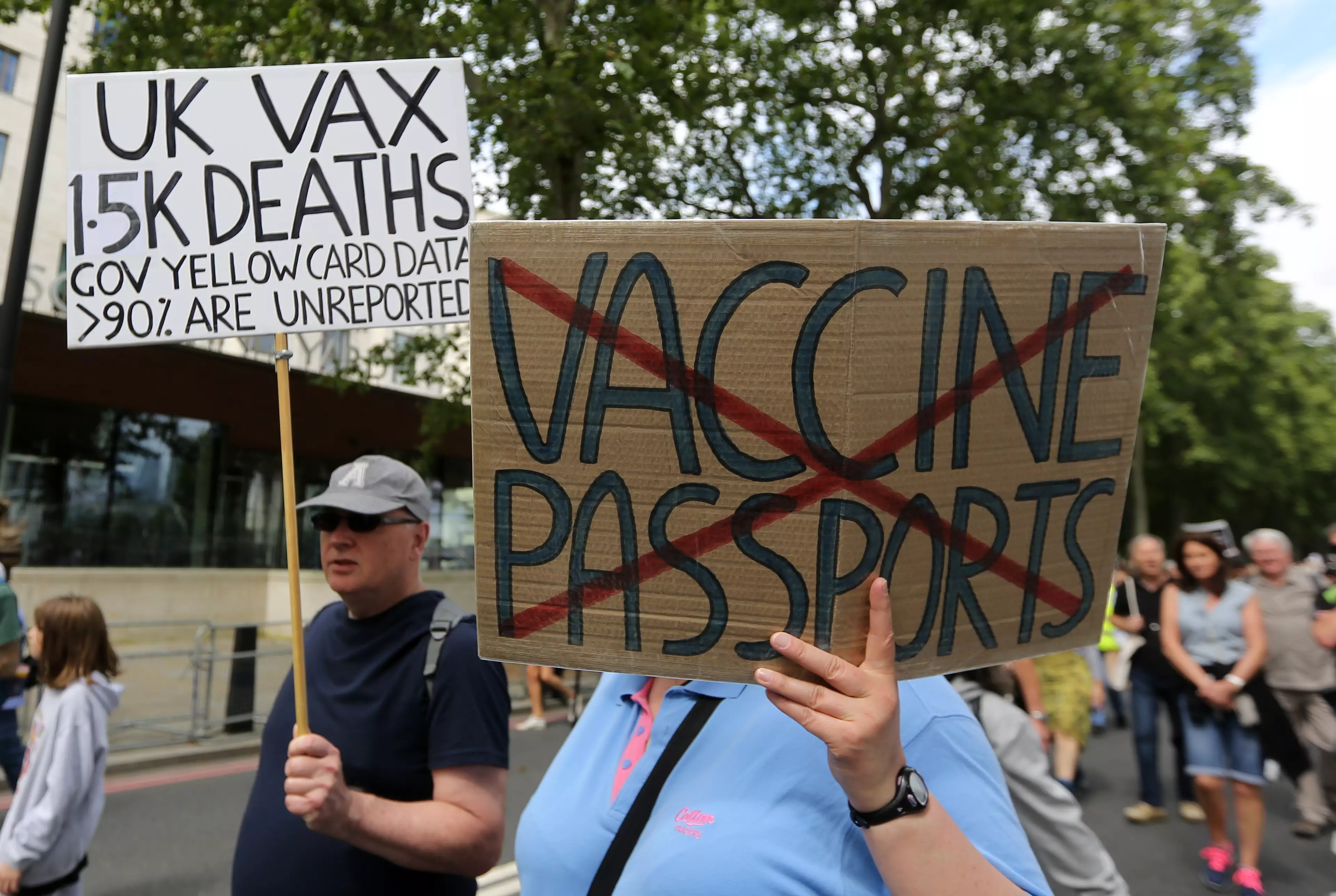 Protesters march through central London against vaccine passport plans.
