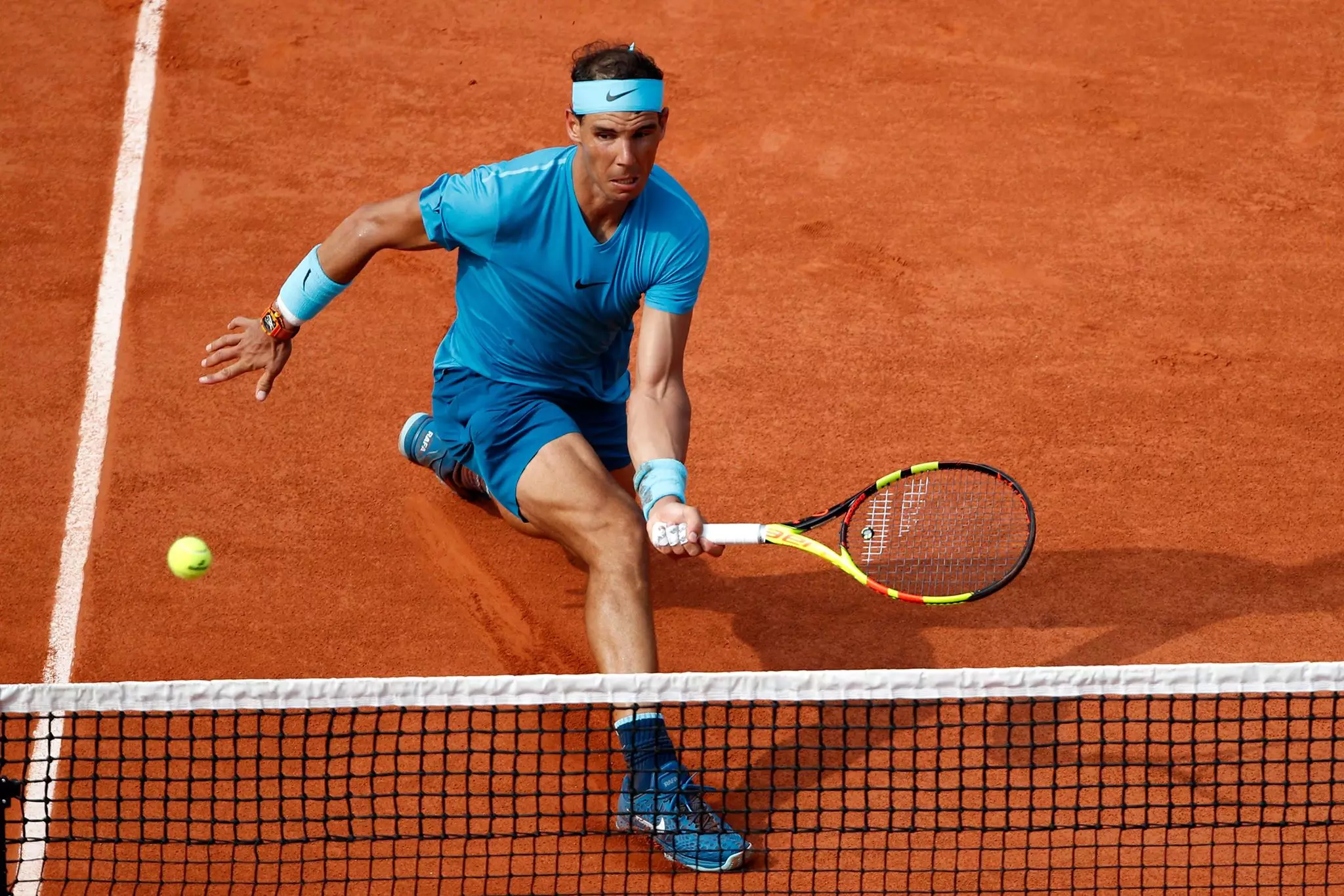 Nadal slides across the clay. Image: PA