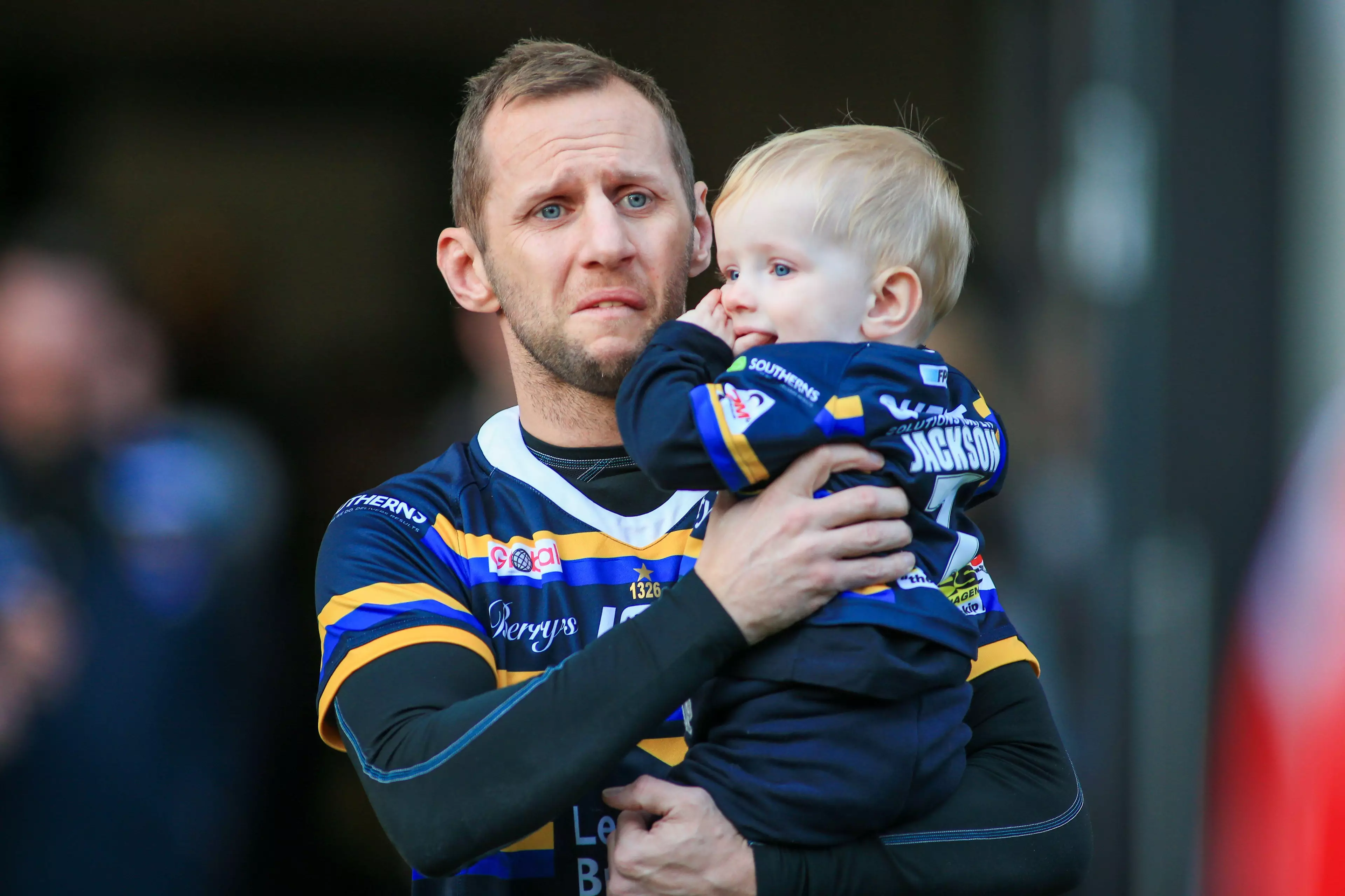 Rob Burrow with his young son.