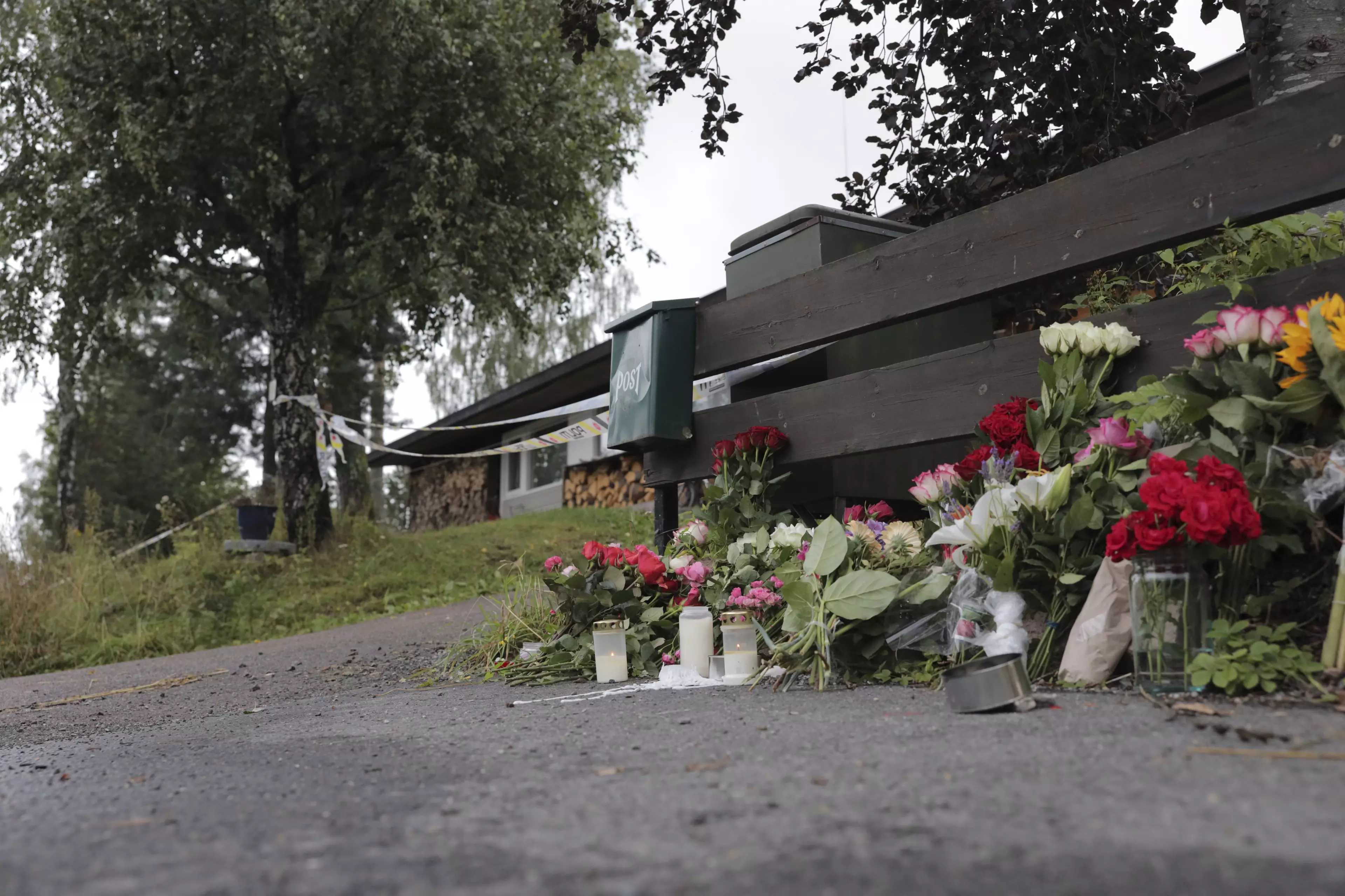 Flowers outside the house where the gunman's stepsister's body was discovered.