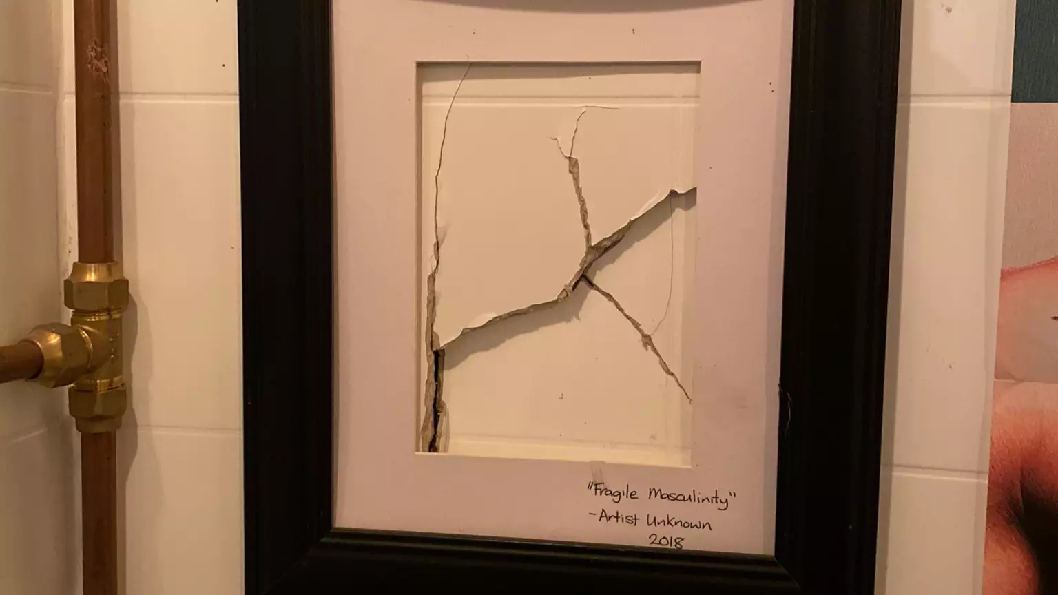 Bar Framed A Hole Punched In Men's Toilet And Named It 'Fragile Masculinity'