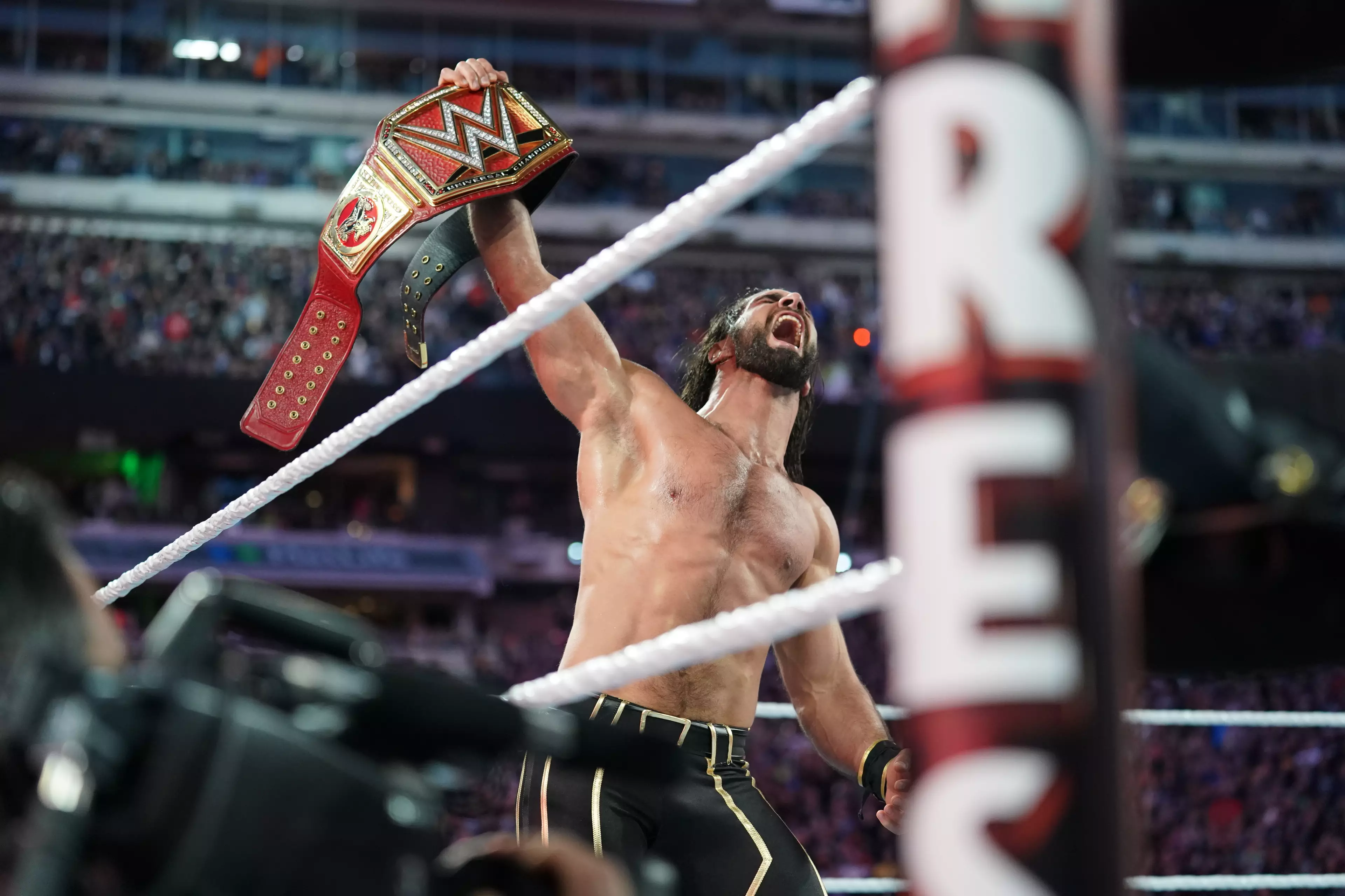 Seth Rollins leaves with his newly won Universal title. Image: PA Images