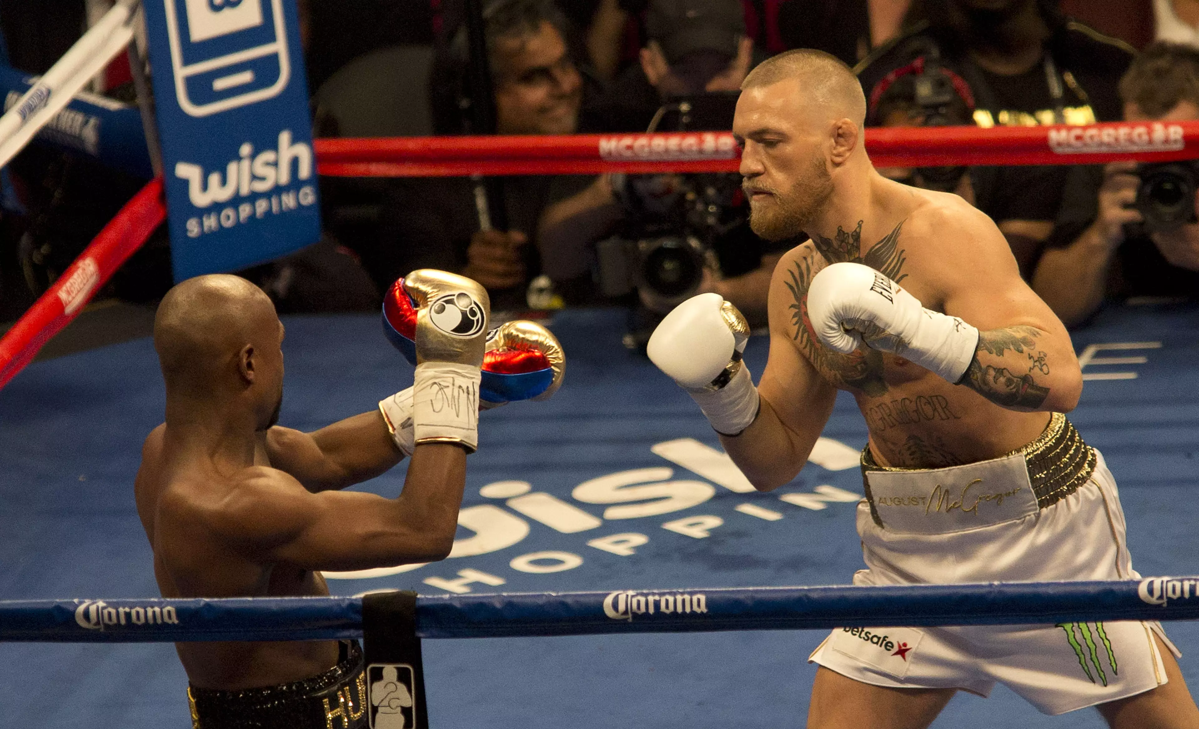 Conor McGregor in the boxing ring against Floyd Mayweather.