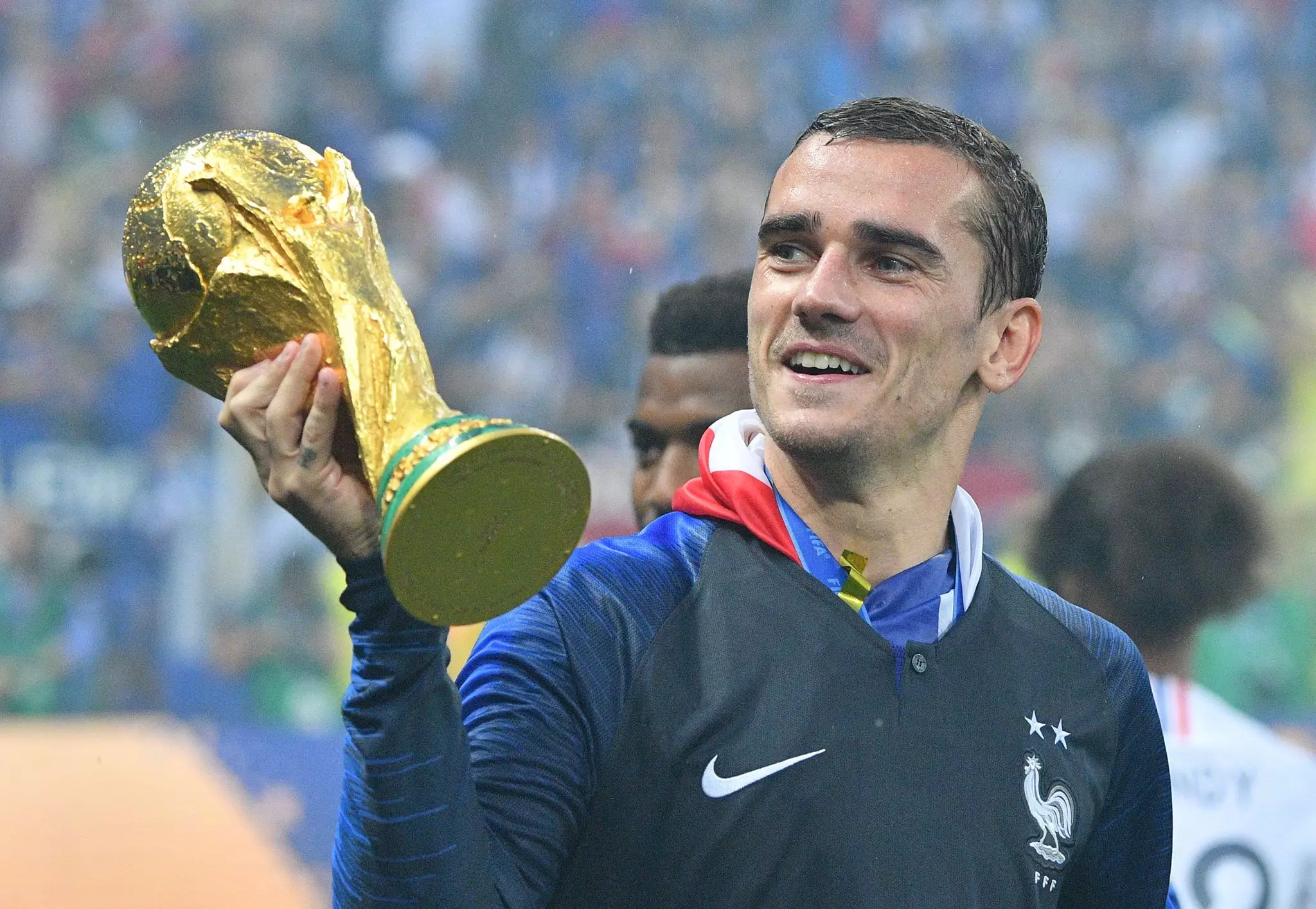 Griezmann celebrates with the World Cup. Image: PA