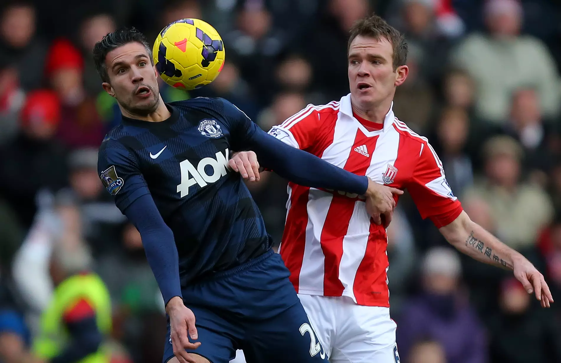van Persie competing for the ball against Whelan. Image: PA