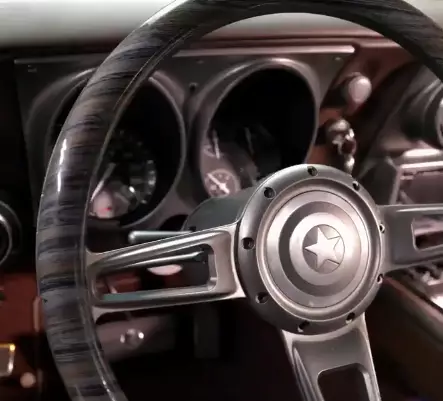 The car's steering wheel features a Captain America shield.