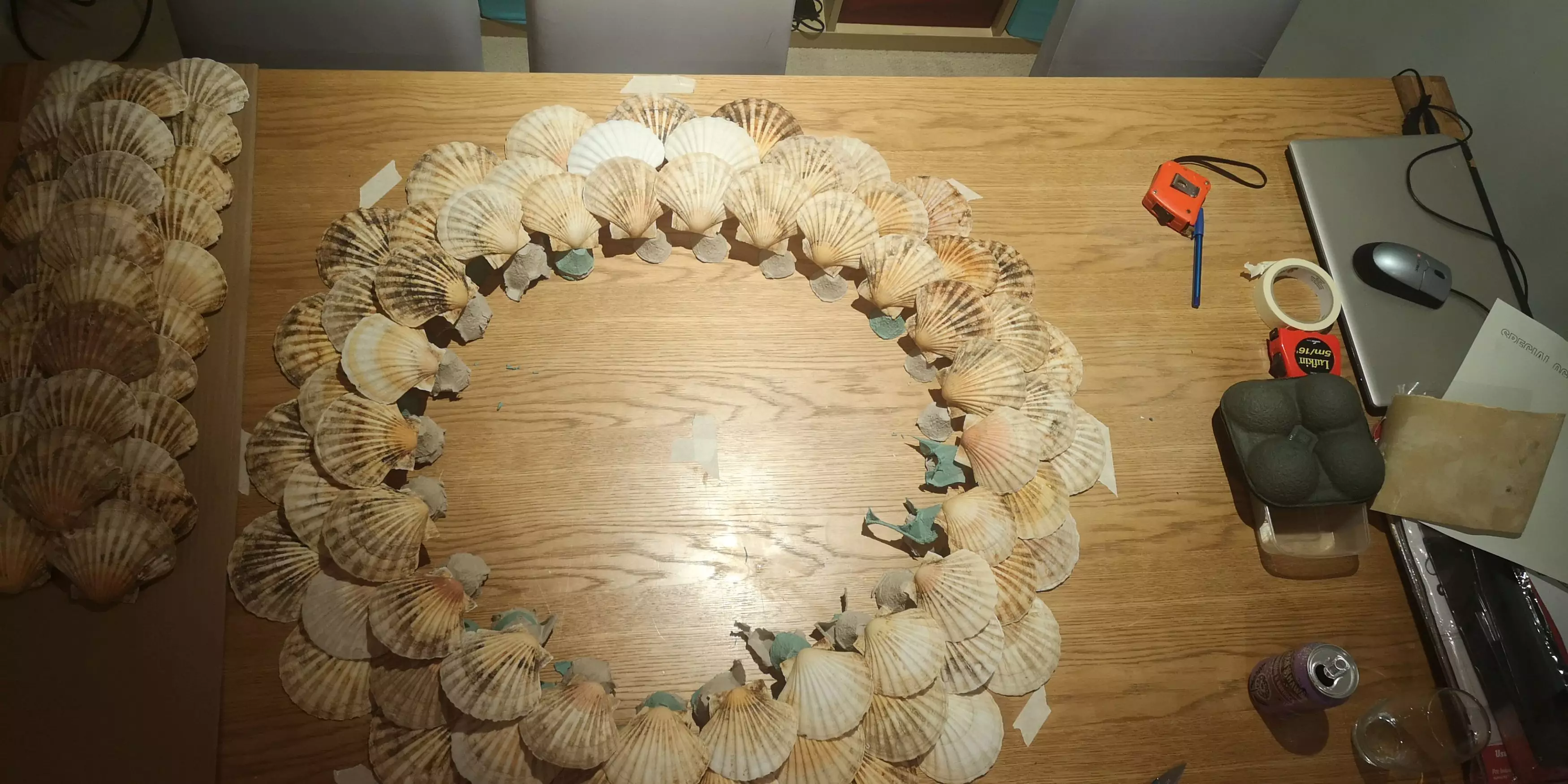 Lisa used a glue gun to stick the shells to the to three circular tiers (