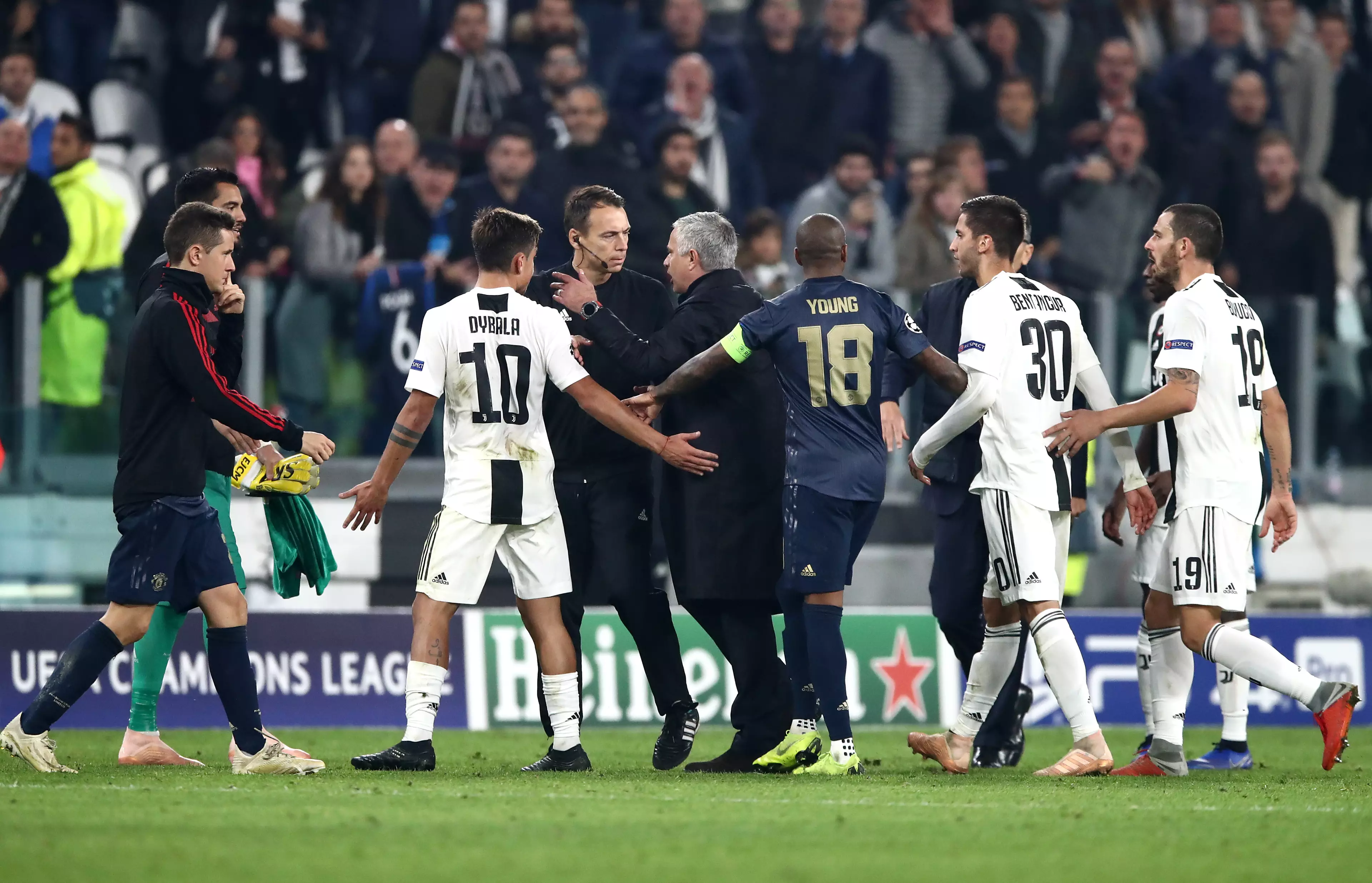 Juventus players surround Mourinho after his final whistle antics. Image: PA Images