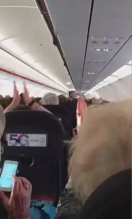 The speech was met with applause from passengers.