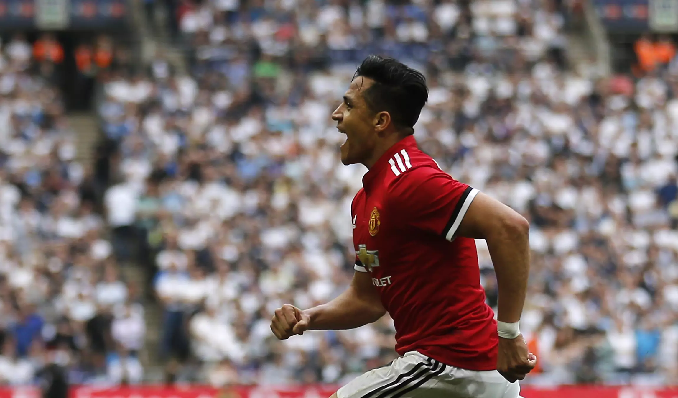 Sanchez celebrates scoring for United. Image: PA