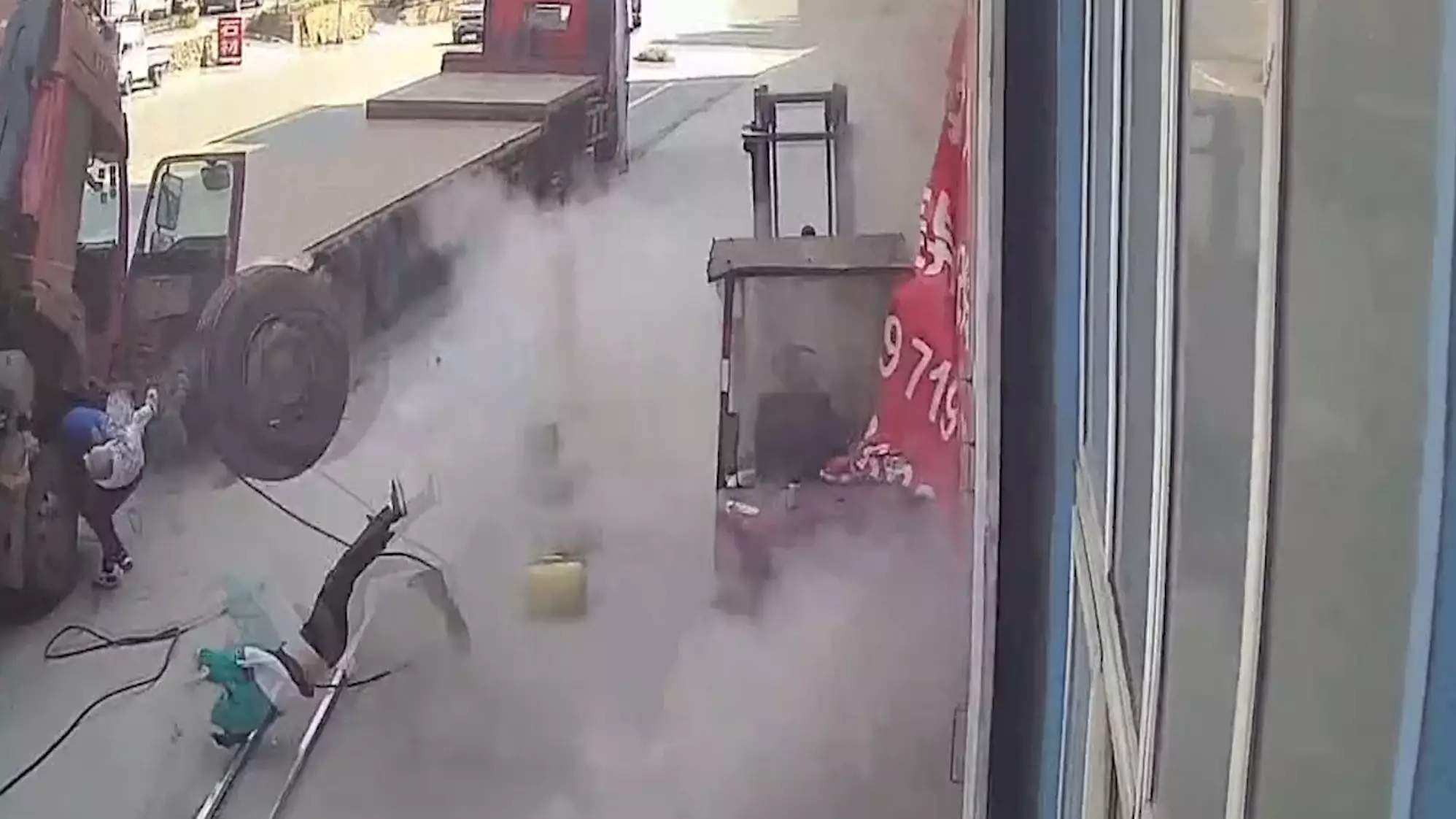 Woman And Child Sent Flying Into The Air By Exploding Tyre