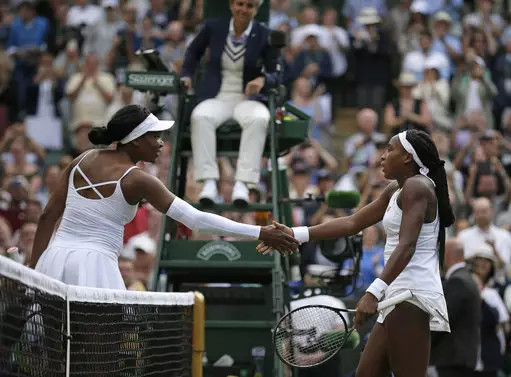 Cori 'Coco' Gauff, right, greets the United States's Venus Williams at the net after winning.