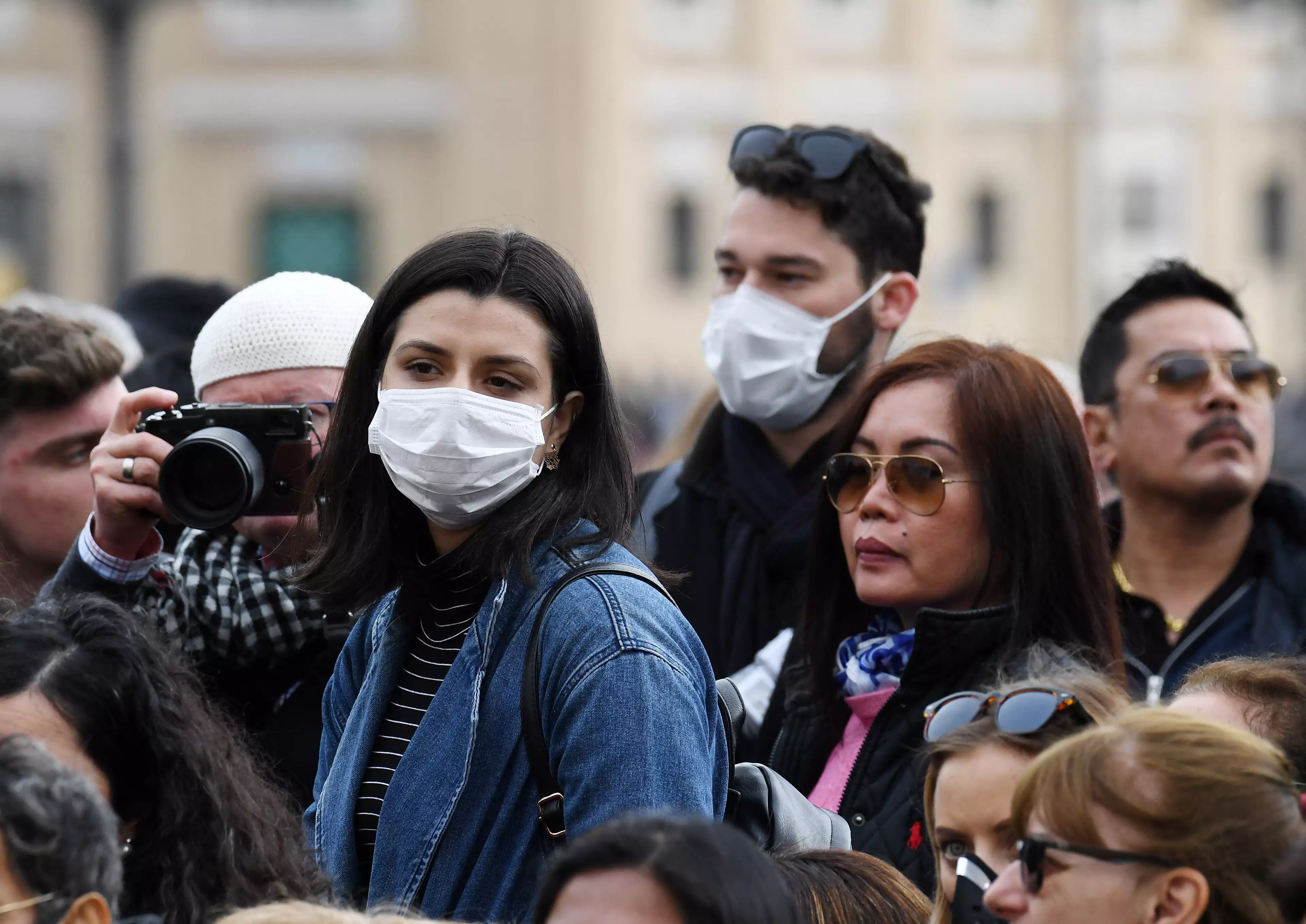 People wearing face masks in Italy (