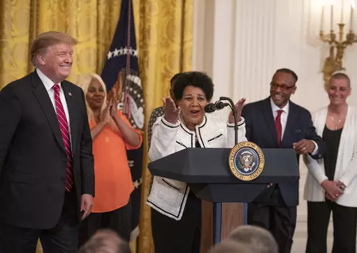 Alice Johnson, a convicted drug trafficker who served 21 years in prison, and who was pardoned after the intervention of Kim Kardashian, with United States President Donald J. Trump.