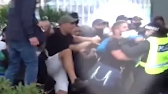 Watch The Moment A Protester 'Protecting Statues' Pushes Police Officer Down Stairs