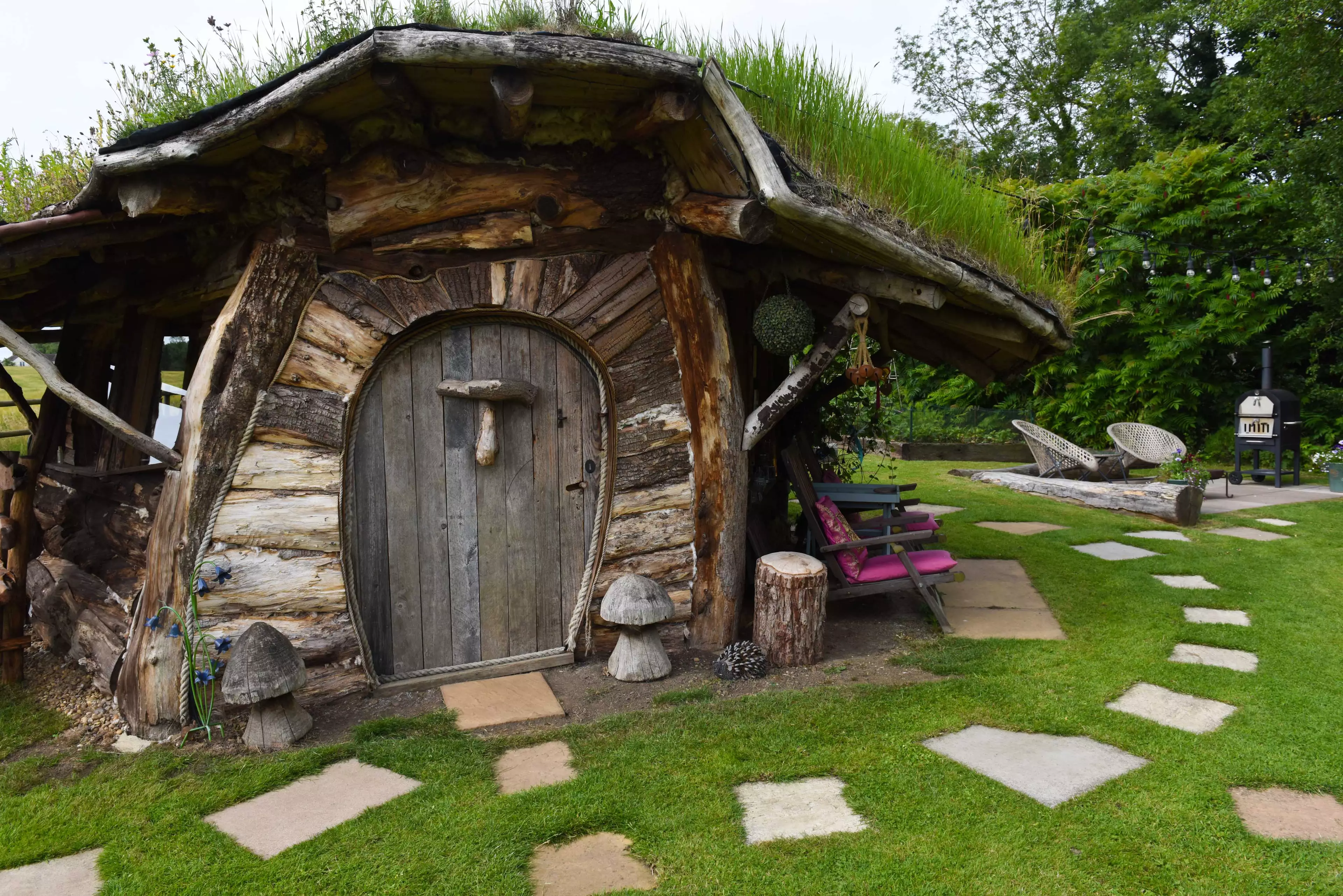 The magical outhouse is surrounded by stepping stones (