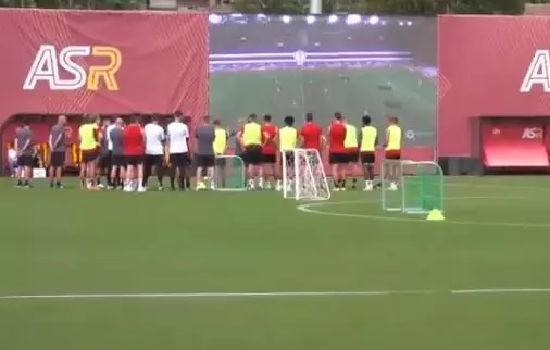 Roma players watching the drone footage on the new screen. Image: Twitter