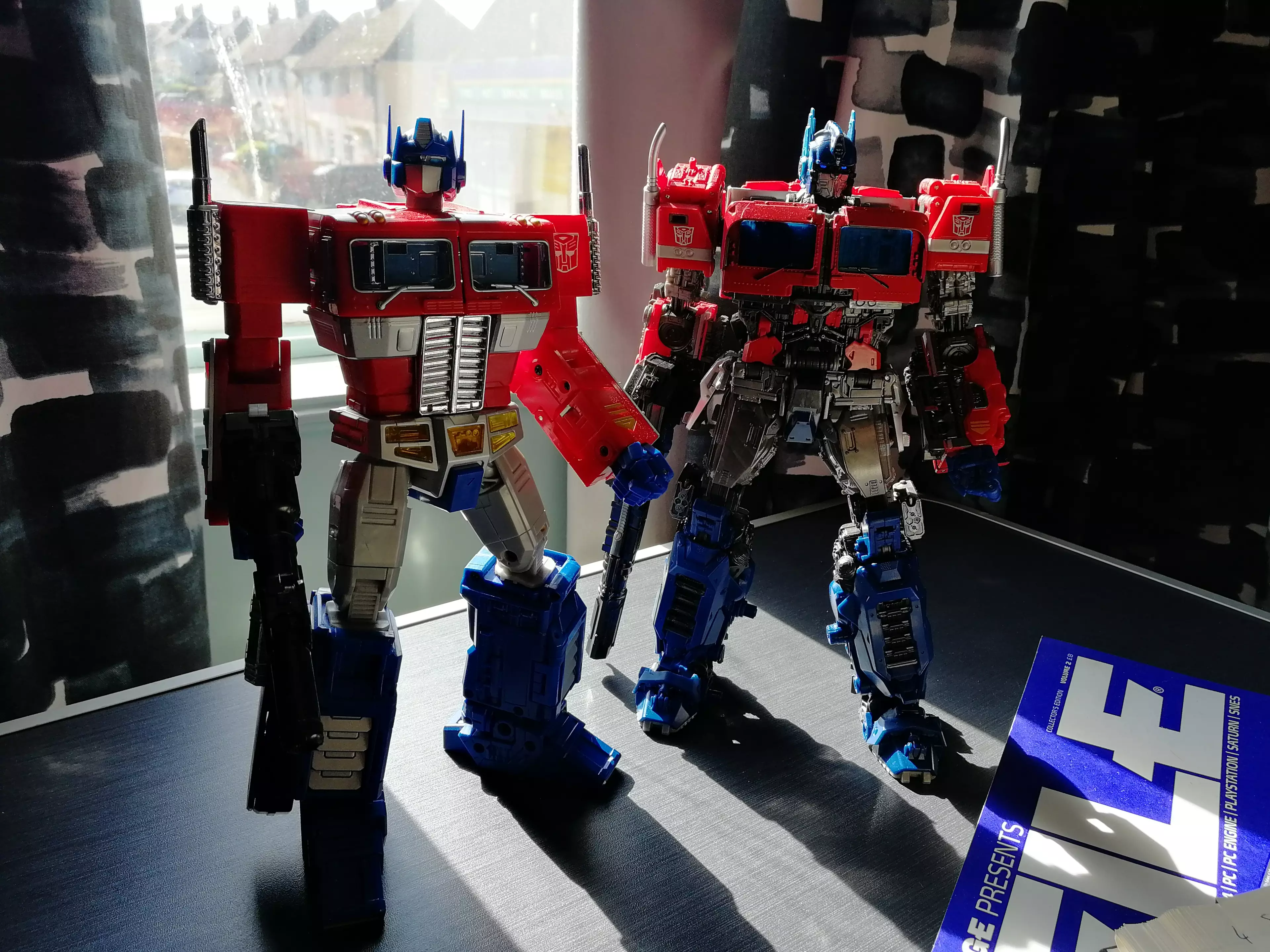 MPM-12 beside an older Masterpiece-line Optimus Prime, MP10 / credit: the author