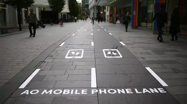 Slow Lanes For Smartphone Users Installed In Busy Manchester Area