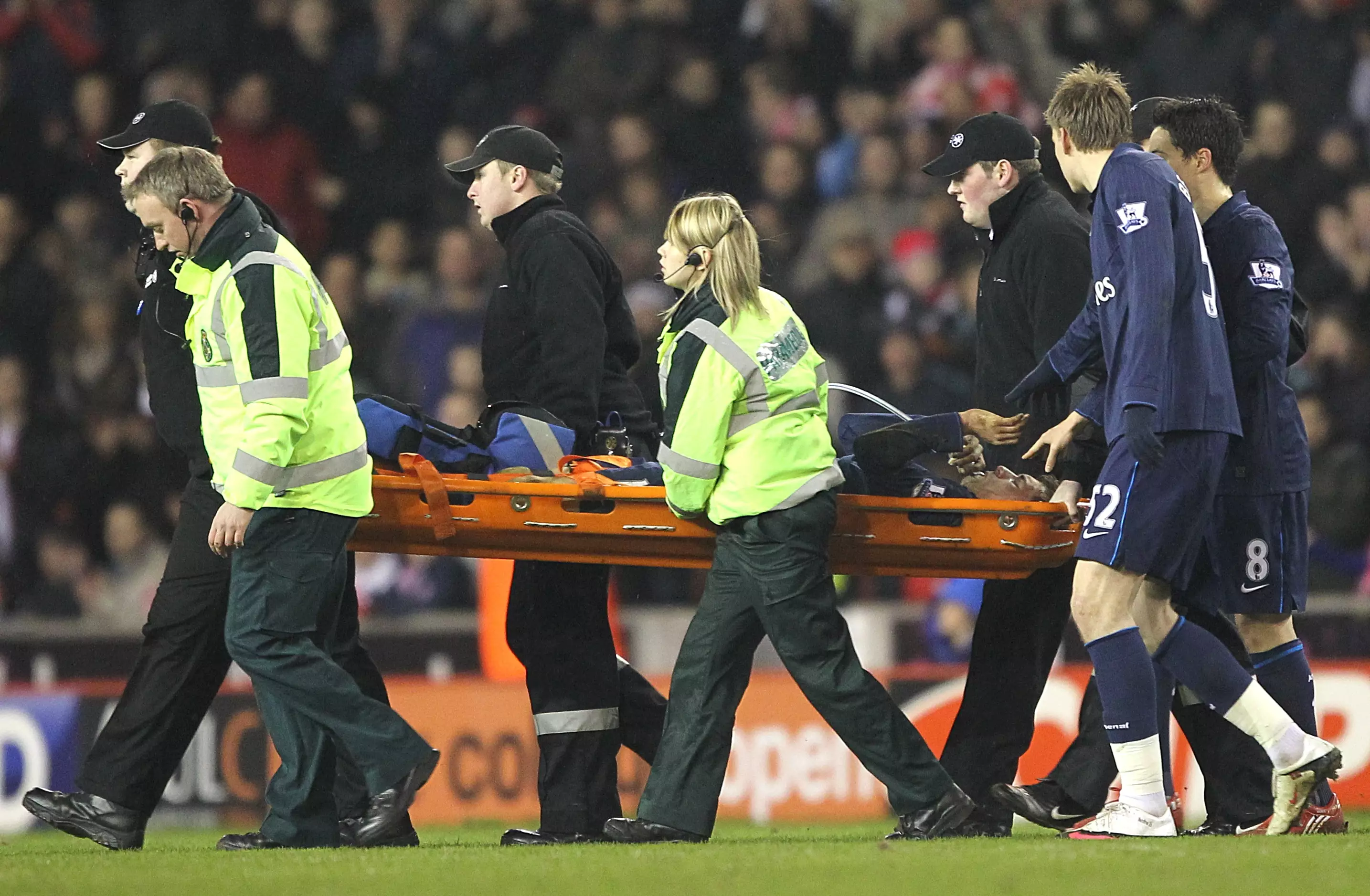Ramsey is stretchered off. Image: PA
